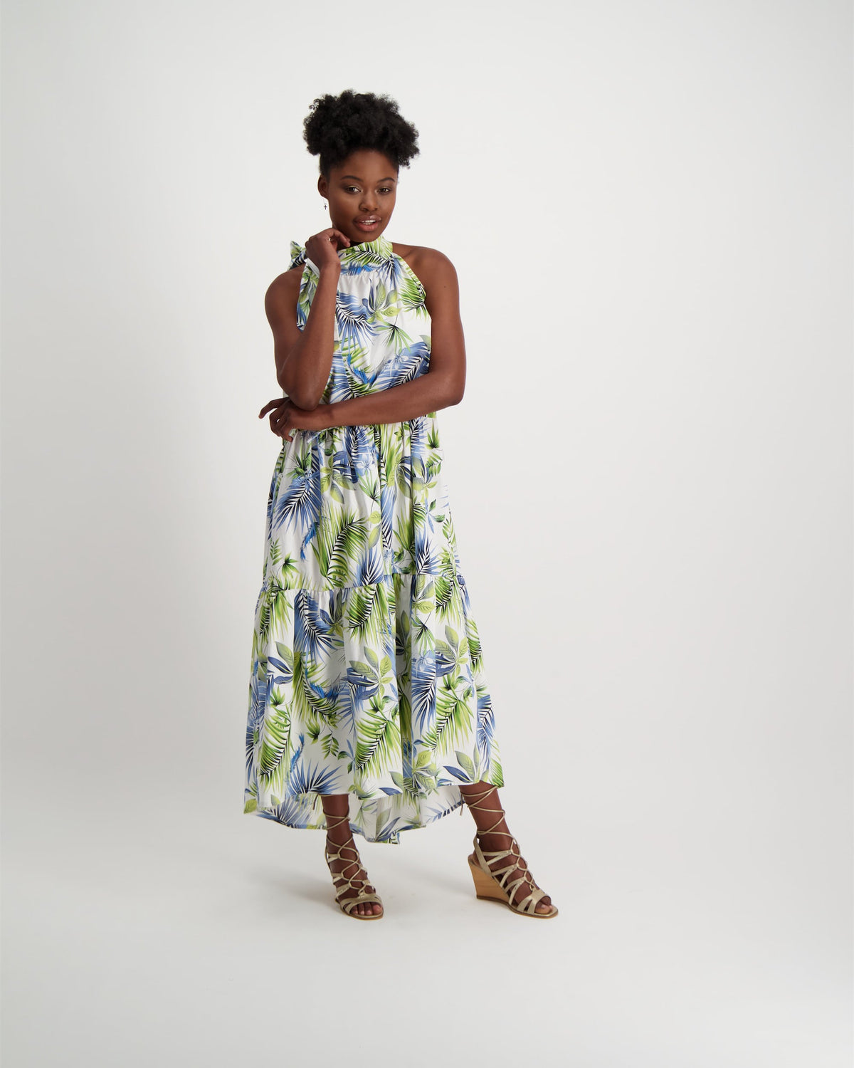 Gorgeous, hand-made, maxi-length halter neck dress, in fresh summer patterned fabric. Worn with wedge strap sandals.